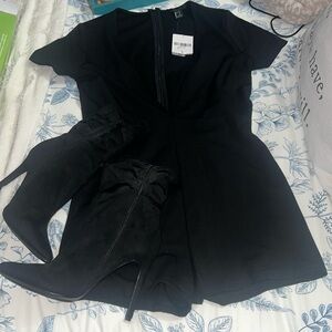BNWT Low V cut black short sleeve short romper.